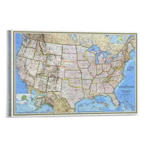 May include: A framed map of the United States, showcasing the country's states and geographical features. The map features a detailed depiction of the US, with a blue ocean border and a decorative border. The title "The United States" is visible.