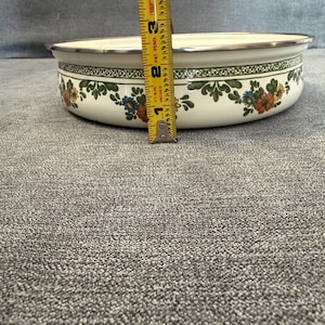 May include: A rustic wooden sign with the text "Welcome to our home" in white lettering. The sign features a distressed finish and a simple, inviting design, perfect for entryway decor.