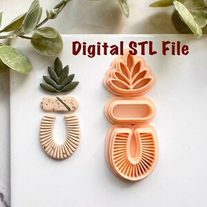 May include: Two sets of polymer clay cutters in a modern, abstract design. One set is assembled, the other is disassembled. The assembled piece is a light green leaf shape, a tan rectangle, and a tan U-shape. The disassembled set is peach-colored and has the text "Digital STL File".