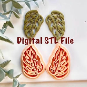 Op de afbeelding: Twee sets bladvormige objecten in olijfgroen en koraal. De bovenste set is olijfgroen met een gedetailleerd bladerpatroon. De onderste set is koraal met een vergelijkbaar ontwerp. De tekst luidt "Digital STL File".