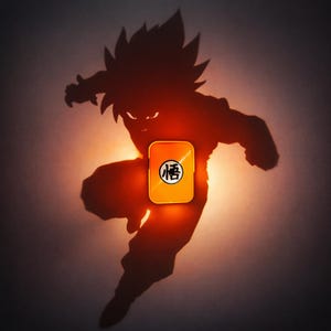 May include: An orange rectangular phone case with a black symbol is centered in front of a silhouette of a character in a fighting pose. The background is a gradient of orange and grey.