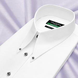 May include: A crisp white long-sleeve dress shirt featuring a sharp point collar with button-down collar points. The inner neck label reads John Clothier London Green Label 100% Cotton. The shirt has a front button placket with dark buttons.