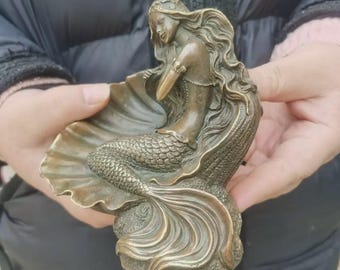 copper mermaid statue