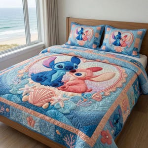 May include: A blue and pink quilt set featuring Stitch and Angel from Lilo & Stitch. The quilt has a central heart-shaped design with the characters, surrounded by seashells and starfish. Includes two matching pillowcases.
