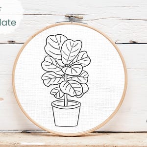 May include: A black and white line drawing of a fiddle-leaf fig plant in a pot, displayed in a wooden embroidery hoop. The text "PDF Template" is in the upper left corner. The Wild Hearted Stitches logo is in the lower right corner.
