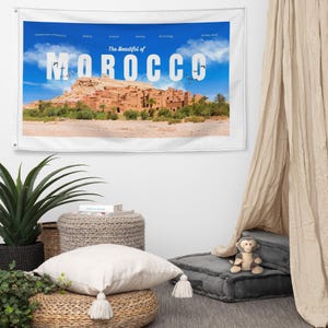 May include: A white wall tapestry featuring a scenic view of Morocco under a blue sky. The text "The Beautiful of MOROCCO" is displayed prominently. Additional text includes "Introduction of Morocco", "History", "Culture", "Society", "Technology", and "16 May 2024".