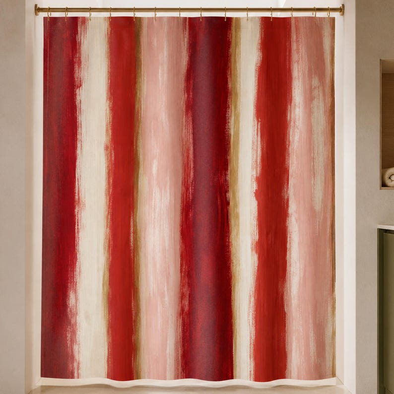 Painterly red stripe shower curtain in a luxury bathroom with oxblood glass, rose stone and olive cabinetry