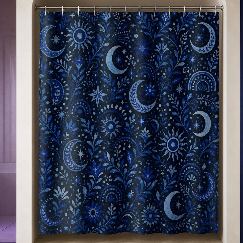 Navy celestial moon and sun shower curtain in a luxury opal bathroom with violet glass and cobalt niche