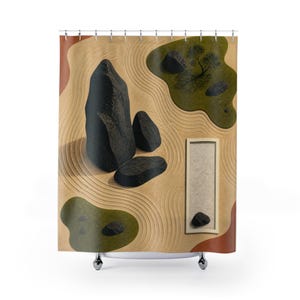 May include: A shower curtain featuring a printed design of a zen garden with tan raked sand, dark gray rocks, green mossy patches, and a rectangular frame containing sand and a single stone. The pattern includes wavy lines and earthy tones.