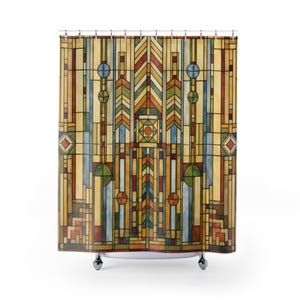May include: A colorful shower curtain with an abstract geometric design. The pattern features vertical and horizontal lines, circles, and diamond shapes in shades of yellow, orange, green, blue, and brown. The curtain hangs from a metal rod with chrome rollers.