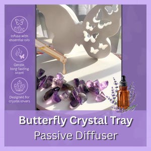 May include: A white butterfly-shaped tray with cutouts, accompanied by purple amethyst crystals and a brown glass dropper bottle. The text reads: Infuse with essential oils, Gentle, long-lasting scent, Designed for crystal lovers, Butterfly Crystal Tray Passive Diffuser.