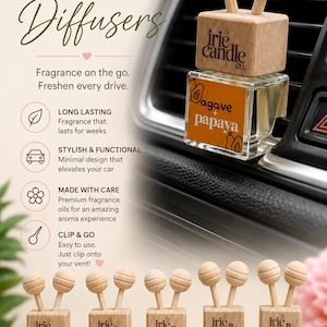 May include: Five square glass car vent diffusers with wooden caps and two wooden spheres on top. Each bottle features a label with the text irie candle co. and scent names: pink dragonfruit, baja cactus, sexy ggil, agave papaya, and black cherry.