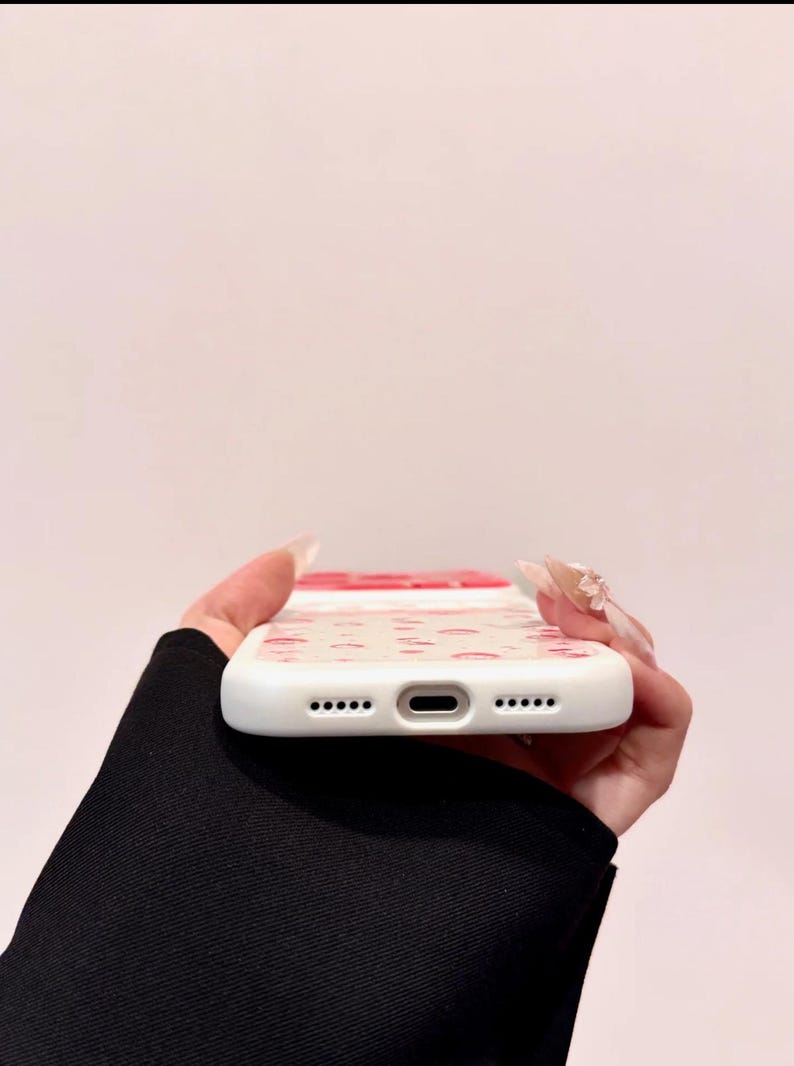 A bottom edge view shows the phone case's charging port cutout and speaker holes.