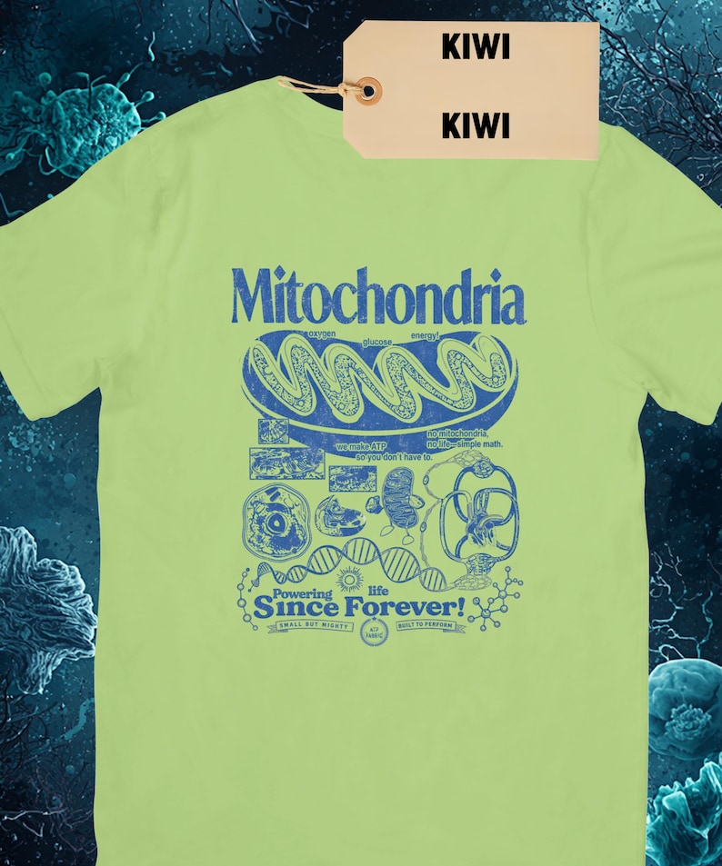 A light green short-sleeve t-shirt with a blue graphic of a mitochondria cell and related scientific diagrams and text, with a brown tag that says "KIWI KIWI."