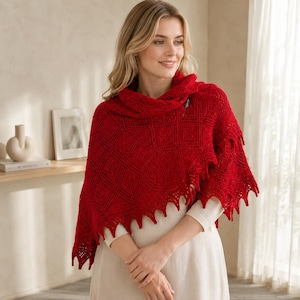 Peut inclure: Un châle tricoté rouge vif présentant un motif géométrique complexe en losanges sur tout le tissu. Le châle possède une surface texturée avec un bord pointu et festonné le long de l'ourlet inférieur, drapé sur un haut uni à manches longues.