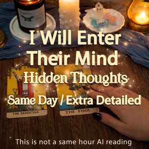 May include: A collection of tarot cards, candles, and crystals arranged on a wooden surface. The cards feature illustrations and text, with the words "I Will Enter Their Mind" visible. The image evokes a sense of spirituality and divination.