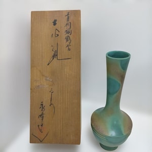 May include: A set of three ceramic mugs with a speckled, matte finish. The mugs are in shades of cream, light grey, and dark grey. Each mug has a simple, minimalist design, ideal for coffee or tea.