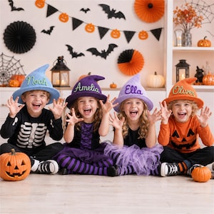 May include: Four children wearing pointed felt witch hats in light blue, purple, lavender, and orange. Each hat features a personalized name embroidered in cursive script: Noah, Amelia, Ella, and Oliver. The hats have a wide brim and a tall, slightly curved crown.