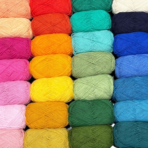 May include: A grid of colorful yarn skeins in various shades, including red, orange, yellow, green, blue, and pink. The yarn is tightly wound, and the arrangement creates a visually appealing display of colors, suitable for knitting or crochet projects.