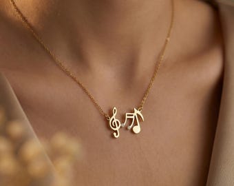 Collar con forma de nota musical y detalles de cristal en oro o plata, un delicado regalo para amantes de la música.