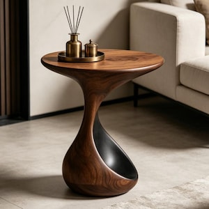 Mesita auxiliar escultural orgánica moderna / Mesa auxiliar minimalista con base hueca / Mueble de diseño único con geometría fluida.