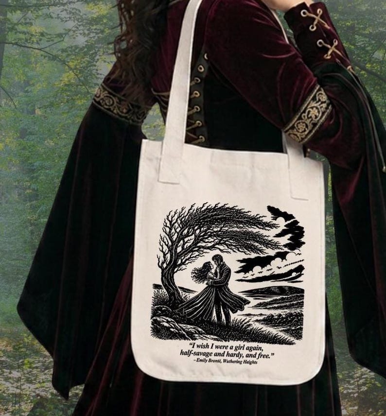 May include: A cream-colored canvas tote bag featuring a black ink illustration of a couple standing under a windswept tree. Below the image, the text reads: "I wish I were a girl again, half-savage and hardy, and free." - Emily Bront&euml;, Wuthering Heights.