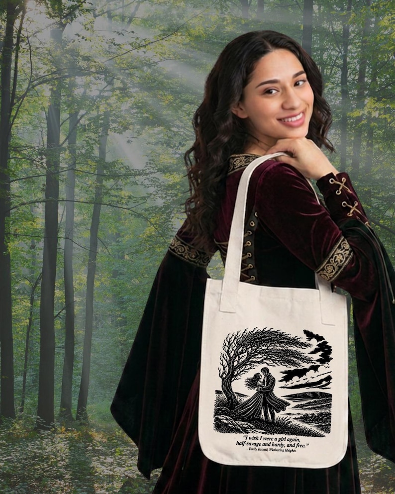 May include: A cream-colored canvas tote bag featuring a black ink illustration of two figures embracing under a windswept tree. Below the illustration, the text reads: "I wish I were a girl again, half-savage and hardy, and free." - Emily Bront&euml;, Wuthering Heights.