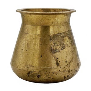May include: A vintage brass pot with a wide, flared rim and a conical body. The pot has horizontal bands and a slightly tarnished appearance, suggesting age. The overall shape is reminiscent of a small vase or container.