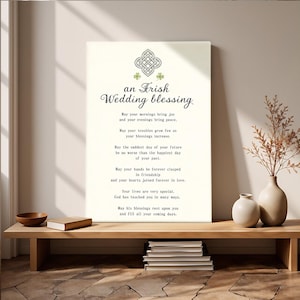 May include: An Irish Wedding Blessing print with a Celtic knot design in green and black. The text includes a wedding blessing with a cream background. The print is displayed on a wooden bench with decorative items.