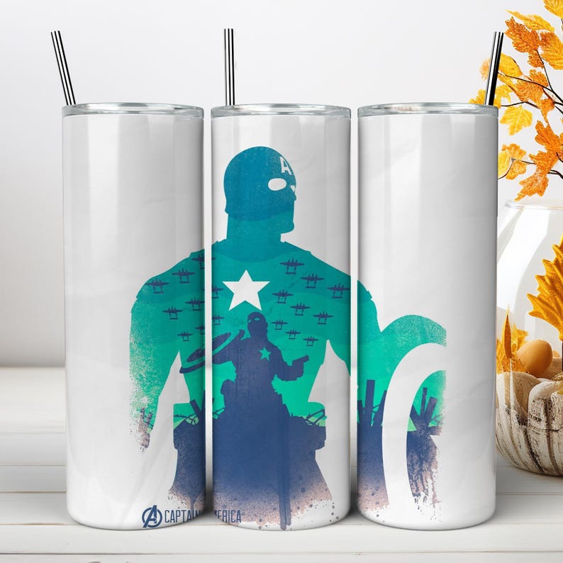 May include: A white cylindrical tumbler with a metal straw featuring a graphic of Captain America in teal and blue tones. The design includes a silhouette of the character, a white star, and the text "CAPTAIN AMERICA" at the bottom base.