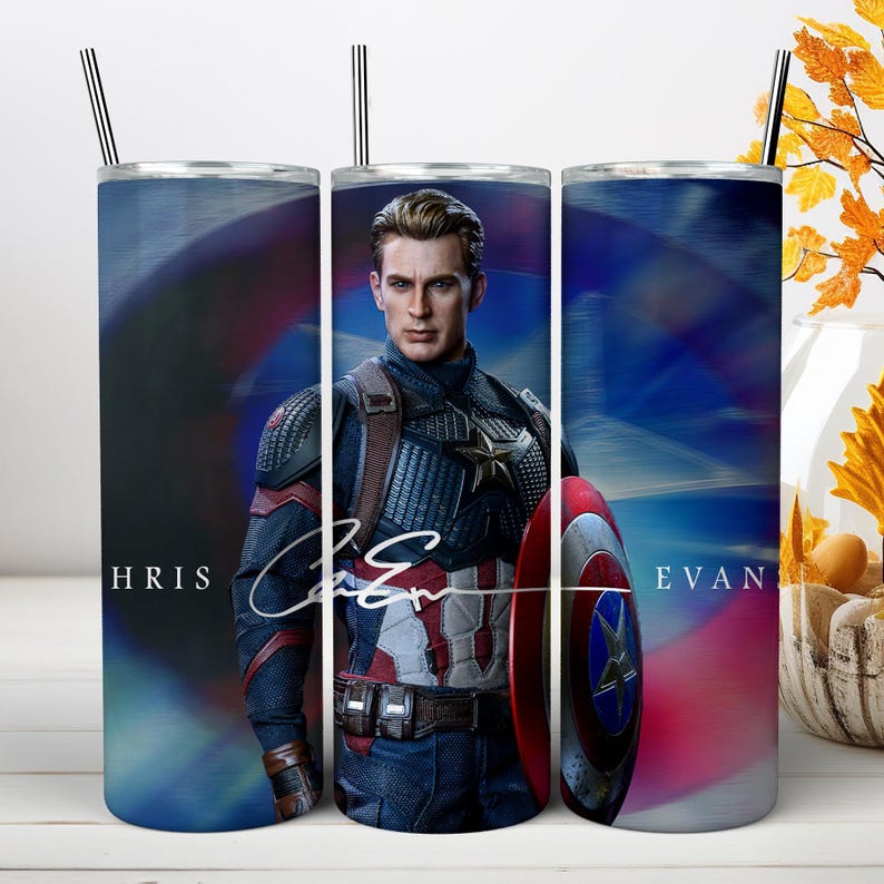May include: A cylindrical metal tumbler featuring a graphic of Captain America in a blue, red, and silver suit with a matching shield. The text "HRIS" and "EVAN" is printed on the sides, with a white signature overlaying the center of the design.