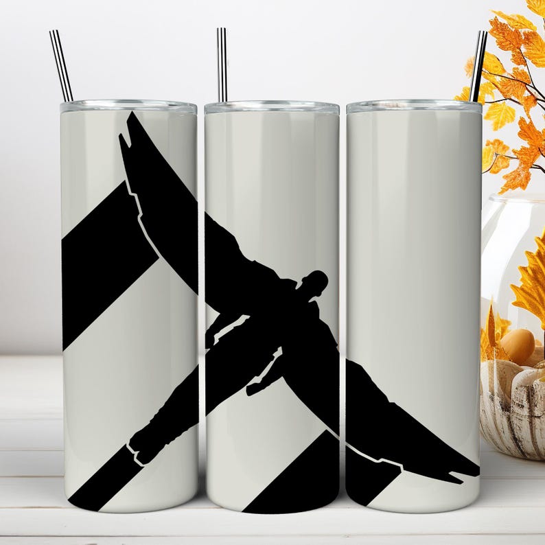 May include: Three cylindrical white tumblers with metal straws, each featuring a black silhouette graphic of a winged figure in flight. The design spans across the three tumblers, showing a person with large wings extended against a plain background.