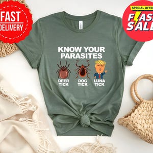 May include: Olive green t-shirt with the text "KNOW YOUR PARASITES" and illustrations of a deer tick, dog tick, and a cartoon of a person. The shirt also has "FAST DELIVERY" and "FLASH SALE" stickers.