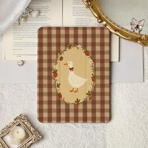 May include: A brown and white checked tablet case. The design features a white goose with a red bow tie, framed by strawberries and flowers. The case has a vintage aesthetic.