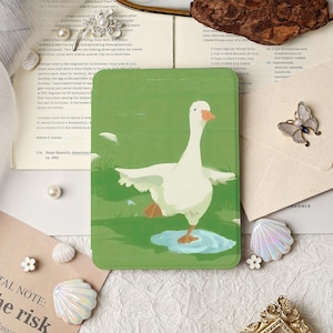 May include: A rectangular green phone case featuring a whimsical illustration of a white goose balancing on one leg in a puddle. The goose has an orange beak and feet. The background is green with white accents.