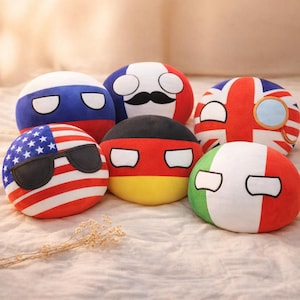 May include: A selection of plush country balls, each designed to represent a different nation. The balls display the flags of the United States, Russia, France, Germany, the United Kingdom, and Italy. The UK ball has a monocle.