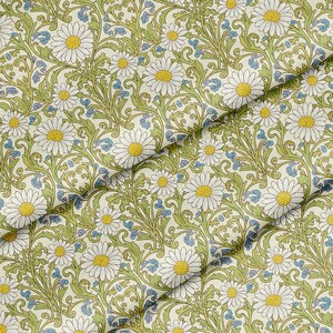 May include: A fabric featuring a repeating pattern of white daisies with yellow centres, intertwined with light green scrolling vines and small blue floral accents on a cream-coloured background. The textile displays a dense, botanical design.