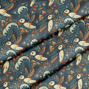 May include: A fabric with a repeating pattern of puffins, waves, and stars on a dark teal background. The puffins are depicted with white, orange, and black markings. The waves are a deep blue, and the stars are gold.