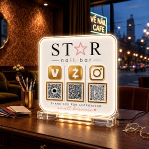 May include: A square, illuminated acrylic sign featuring the text STAR nail bar, three gold social media icons, and three corresponding QR codes. The bottom text reads THANK YOU FOR SUPPORTING small business with a small heart icon.