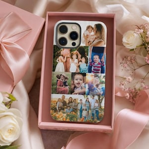 May include: A smartphone case featuring a collage of family photos. The case is displayed in a pink gift box with a satin ribbon and flowers. The case has a black camera lens cutout and a glossy finish.