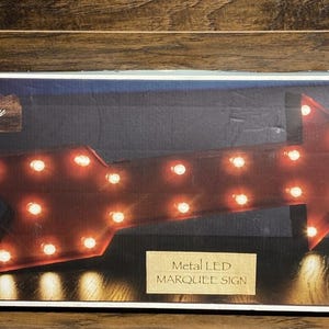 May include: A handmade wooden sign with the text "Welcome" in a handwritten style. The sign is painted white with a distressed finish and features a small, decorative heart. It is designed for indoor or outdoor use.