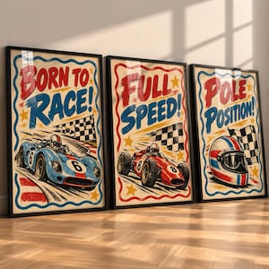 May include: Three framed vertical posters with a cream background and scalloped blue borders. The first shows a blue race car with the text BORN TO RACE. The second shows a red race car with the text FULL SPEED. The third shows a racing helmet with the text POLE POSITION.