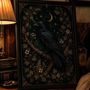 May include: A framed rectangular wall art print featuring a black raven perched on a tree branch. The dark green background is adorned with gold-toned leaves, small white flowers, a crescent moon, and stars, all enclosed within an ornate border.
