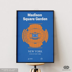 May include: A framed poster with a blue background features the text "Madison Square Garden" and "New York". An orange architectural illustration of the arena is centered. The poster includes the text "STATE OF NEW YORK" and the number "19,812".