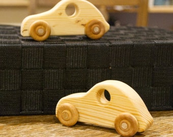 2 ea. Pine Wood Tesla Cars