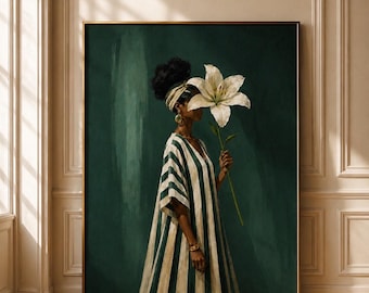 May include: A framed wall art print featuring a person in a dark green and white striped kaftan, wearing a matching headwrap and gold jewelry. The person holds a large white lily flower in front of their face against a deep green painted background.