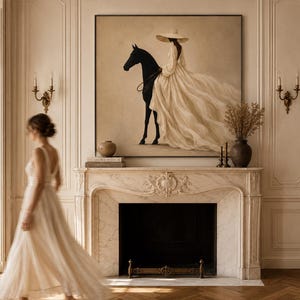 May include: A large square wall art piece featuring a painting of a person in a wide-brimmed hat and a flowing cream-colored gown riding a black horse. The artwork is displayed above a marble fireplace mantel in a room with light-colored walls.