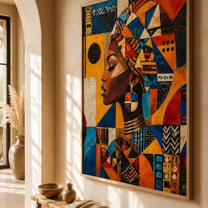 May include: A framed abstract painting depicting a woman's profile with a patterned head wrap and jewellery. The artwork uses geometric shapes and a vibrant palette of orange, blue, yellow, and black. The painting is displayed in a well-lit room.