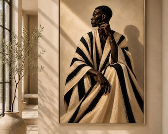 May include: A framed wall art print featuring a portrait of a person with short dark hair, wearing a draped garment with bold vertical black and beige stripes. The person is seated in profile, resting a hand near their chin, set against a textured beige background.