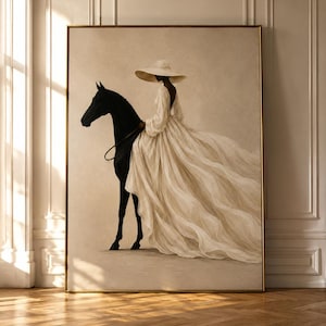 May include: A framed wall art print featuring a painting of a person wearing a wide-brimmed hat and a long, flowing cream-colored gown while riding a solid black horse. The artwork is set against a neutral beige background with a thin gold frame.